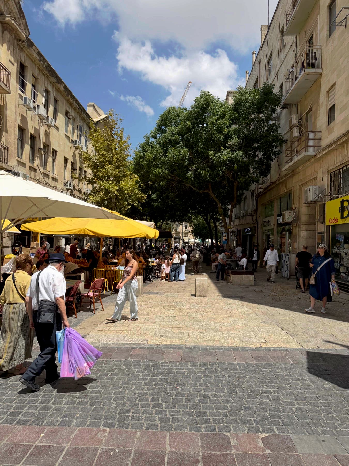 Shoppers and pavement cafés along Ben Yehuda Street in central Jerusalem on a summer afternoon