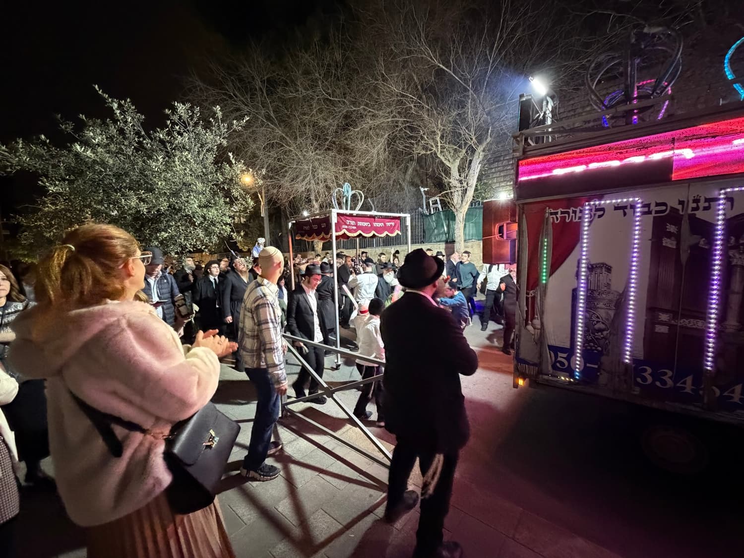 An evening Hachnasat Sefer Torah procession in Jerusalem