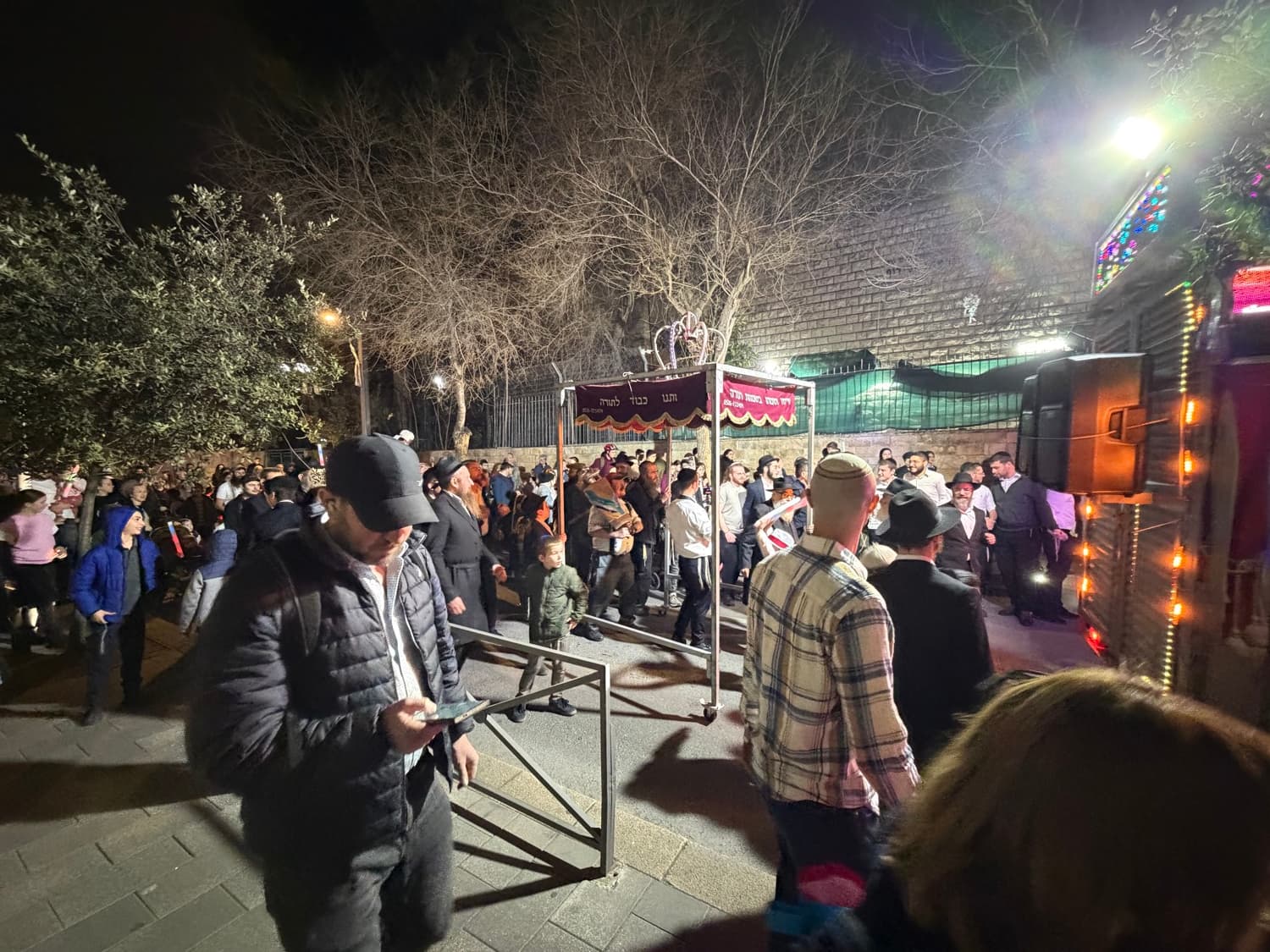 Crowds accompanying a new Torah scroll in Jerusalem